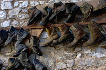 Eccentric collection of old boots, New Quay, Teignmouth, Devon, UK