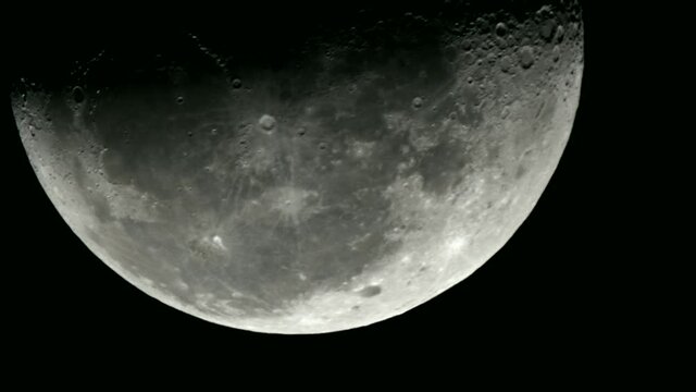 Moon in last quarter moves through the image of a telescope