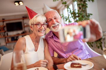 Senior couple celebrating birthday.