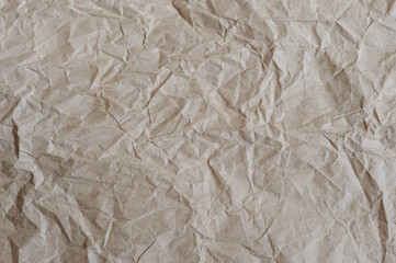 Crumpled wrapping paper as background.