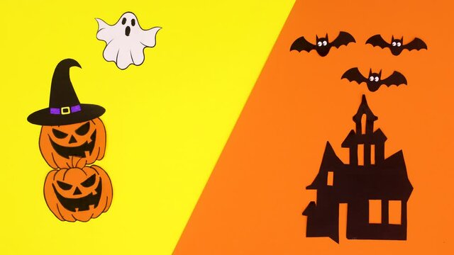 Happy Halloween title appear on yellow orange theme with creepy house, bats, ghost and pumpkins. Stop motion 