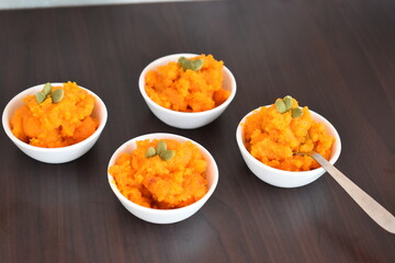 delicious and fresh tasty carrot halwa with ghee and pumpkin seed on topping