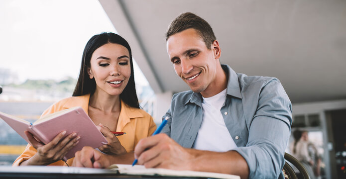 Content students writing in notebooks together