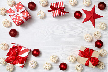 Christmas gift box, Christmas ball Ornaments on white wood top flat layout blank copy space for text.