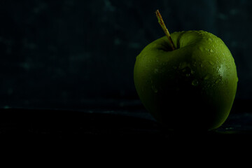 apples in a transparent vase on a blue background, one apple, three apples, fresh apples, red apple, green apple, yellow apple, bitten apple