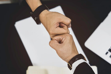 Business people with the Partnership Team Giving Fist Bump after complete deal as  Successful Teamwork Partnership in an Office