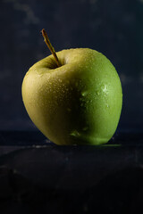 apples in a transparent vase on a blue background, one apple, three apples, fresh apples, red apple, green apple, yellow apple, bitten apple