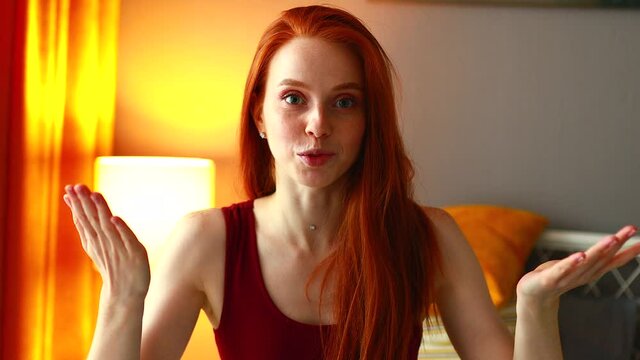 redhaired ginger woman talking some interesting story with face facial expressions eye to eye