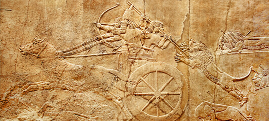 Assyrian wall relief of lion hunt, king Ashurbanipal with warriors on carving from Middle East and...