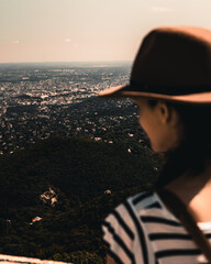 Fototapeta premium woman in hat with beautiful panoramic view from a lookout