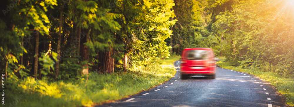 Canvas Prints red car on asphalt road in summer