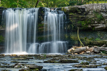 Fototapeta premium Keila waterfall in Estonia. Summer, long exposure ar daytime.