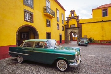Funchal, Madeira, Portugal - 12/13/2015: Luxury old timer car in the courtyard of the Sao Tiago fort, dreamy style