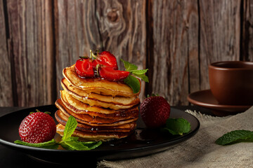 Delicious, only baked pancakes with fresh aromatic strawberries