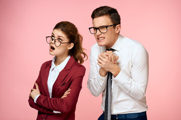 business man and woman office work colleagues team office management studio pink background