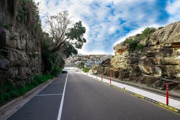 Bronte Beach car park between two rock cliffs with views of the houses on cliff tops Sydney Australia 