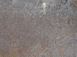metal starting to rust on a dark background