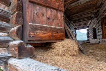 Fototapeta na wymiar Ancient wooden barn with valley view, Antagnod, Aosta Valley, Italy