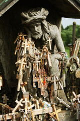 Fototapeta na wymiar Legendary and holy Hill of Crosses, Siauliai, Lithuania is place of pilgrimage and worship for Christians of whole world. The Hill of Crosses is a unique monument of history and religious folk art