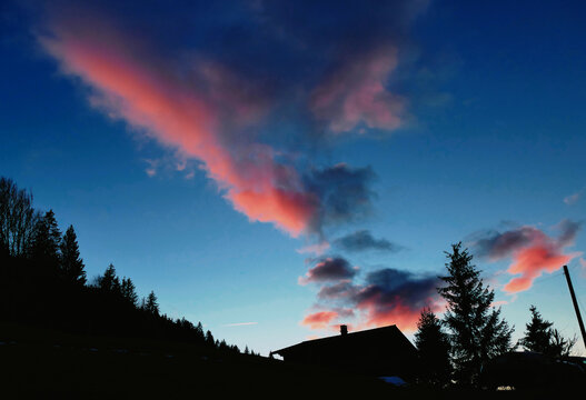 Evening Sky with Pink Clouds over Rougemont Switzerland