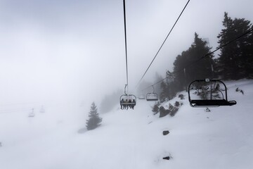 Fototapeta na wymiar Ski lift at the Alps on the slopes
