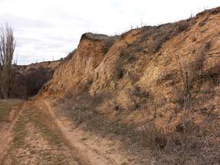 Rockslide. Mountain landslide in an environmentally hazardous area. Large cracks in earth, descent...
