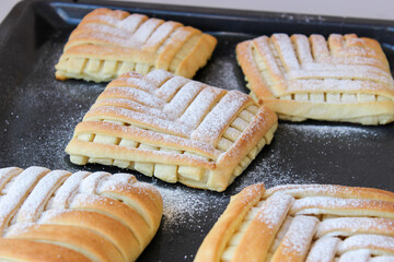 Sweet pastries in the shape of a square with an interesting pattern, stuffed with oranges and lemons,