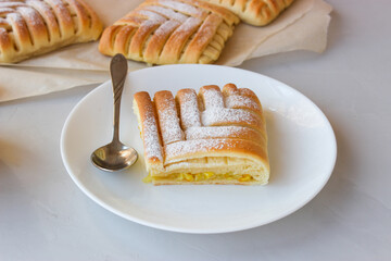 Sweet pastries in the shape of a square with an interesting pattern, stuffed with oranges and lemons,