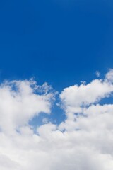 Deep blue sky with white clouds, copy space