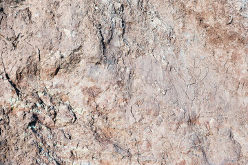 Background of mountain landslide in an environmentally hazardous area. Large cracks in the ground, the descent of soil layers, coquina. Deadly risk of coastal collapse