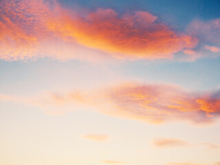 Setting Sun Sunset in the Sky. Sky blue and orange light of the sun through the clouds in the sky