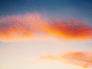 Setting Sun Sunset in the Sky. Sky blue and orange light of the sun through the clouds in the sky