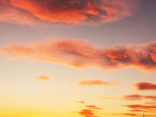 Setting Sun Sunset in the Sky. Sky blue and orange light of the sun through the clouds in the sky