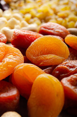 Pile of dried apricots on kitchen table. Healthy nutritious natural food