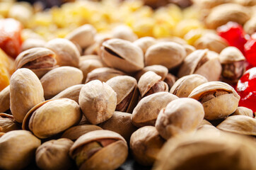 Closeup view at pistachio nuts on kitchen table. Vegetarian food concept
