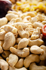 Closeup view at cashew nuts on kitchen table. Vegetarian food concept