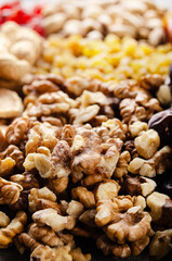 Closeup view at walnut nuts on kitchen table. Vegetarian food concept
