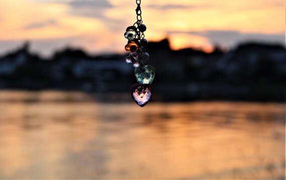 A key ring in the background sets the sun on Lake Bodesee in Germany.