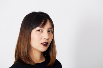 Fototapeta premium Asian Woman in black dress on white