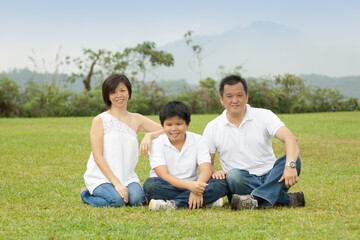 Asian family enjoying  happy and joyful day out in outdoor nature