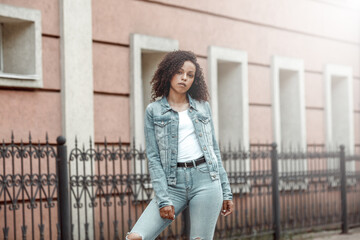 black curly girl on street