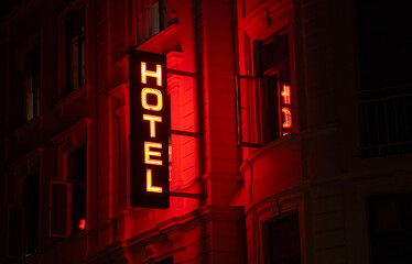 Illuminated hotel sign at night