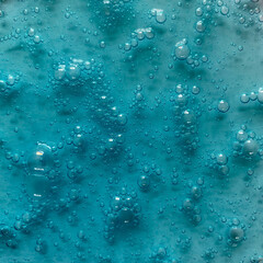 Cosmetic gel cream texture for background.  Blue gel with air bubbles.  Close-up.  Copy space for your text.  Beauty concept.