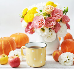 Autumn harvest pumpkin background. Pumpkins, apples and flowers on table. Thanksgiving table. Copy space. Halloween or seasonal autumnal. Design mock up. Greeting card. Fall kitchen.