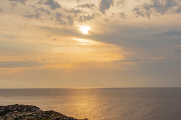 beautiful seascape with sun in the clouds, glowing clouds over the sea. Seascape