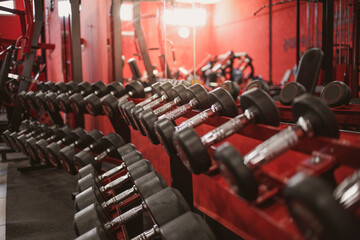 Dumbbells in the gym background close up fitness concept in fitness centre