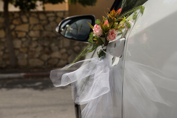 Decorative flower decoration of the bride and groom car