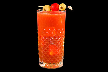 Bloody mary cocktail in glass with ice cubes and olives,