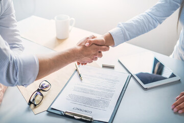 Business people shaking hands, finishing up meeting.