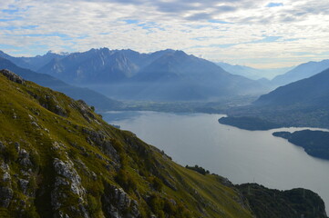 Reflections of the mountains around Lake Como in Lombardy, Northern Italy